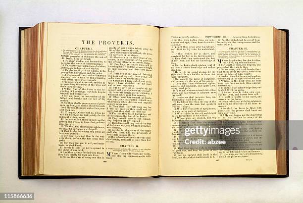 church bible open at the book of proverbs - old book cover stock pictures, royalty-free photos & images