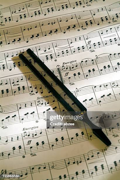 sheet music with tuning fork 02 - tuning stock pictures, royalty-free photos & images