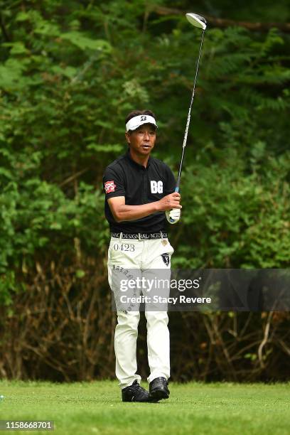 Kohki Idoki of Japan hits his tee shot on the ninth hole during the first round of the U.S. Senior Open Championship at the Warren Golf Course on...