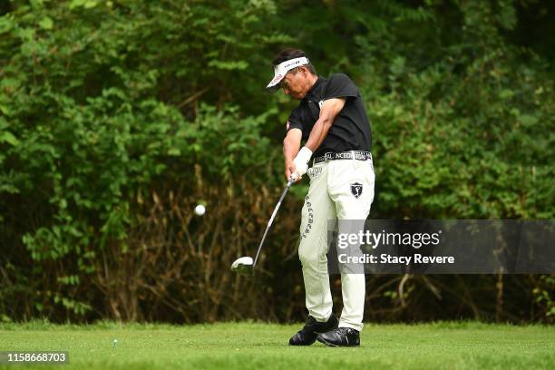 Kohki Idoki of Japan hits his tee shot on the ninth hole during the first round of the U.S. Senior Open Championship at the Warren Golf Course on...