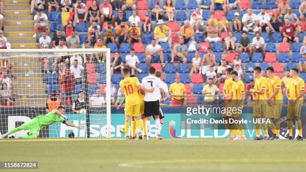 Luca Waldschmidt of Germany scores his team's third goal during the 2019 UEFA U-21 Semi-Final match between Germany and Romania at Stadio Renato...