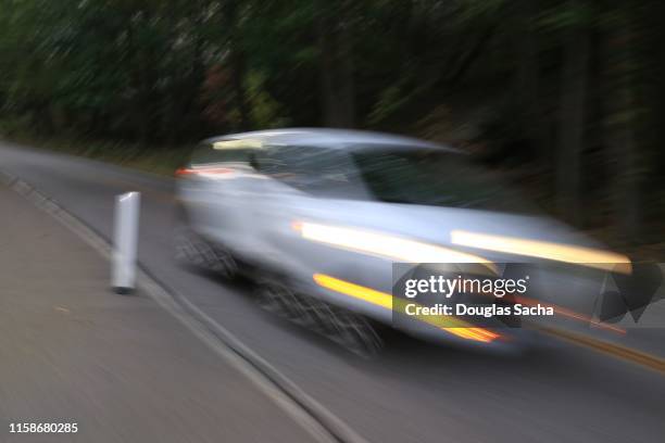 fast moving vehicle, blurred motion - fast motion stock pictures, royalty-free photos & images