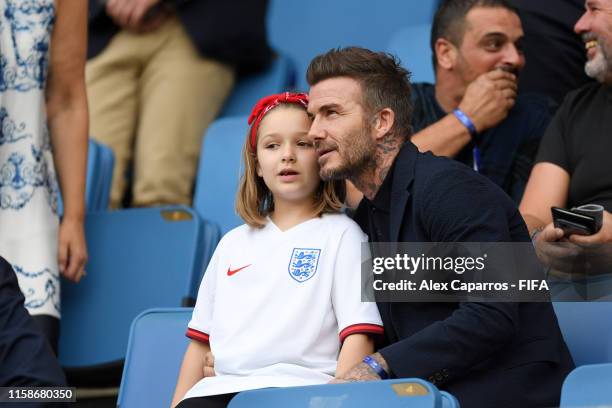 David Beckham is seen in the stands with his daughter, Harper, prior to the 2019 FIFA Women's World Cup France Quarter Final match between Norway and...