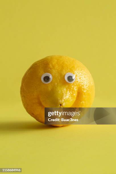 lemon with googly eyes - wackelaugen stock-fotos und bilder