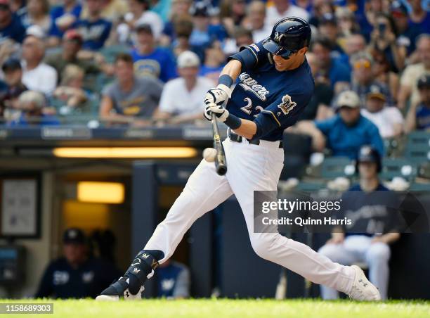 Christian Yelich of the Milwaukee Brewers hits a single in the fifth inning against the Seattle Mariners at Miller Park on June 27, 2019 in...