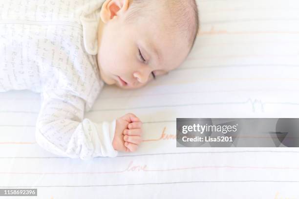 sweet baby sleeping in a crib - one baby girl only stock pictures, royalty-free photos & images