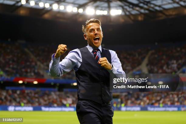 Philip Neville, Head Coach of England celebrates after his team's third goal during the 2019 FIFA Women's World Cup France Quarter Final match...