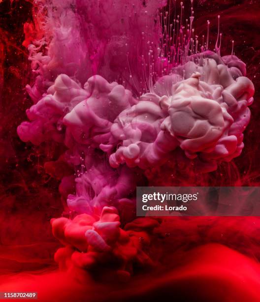 flower in colourful water - ink water stock pictures, royalty-free photos & images