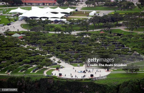 In this aerial image, people visit the Heiwa no Ishiji monument on the day marking the 74th anniversary of end of the Battle of Okinawa on June 23,...