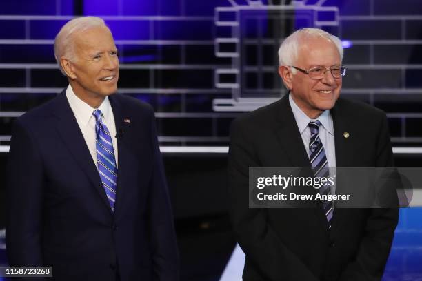 Former Vice President Joe Biden and Sen. Bernie Sanders take the stage for the second night of the first Democratic presidential debate on June 27,...