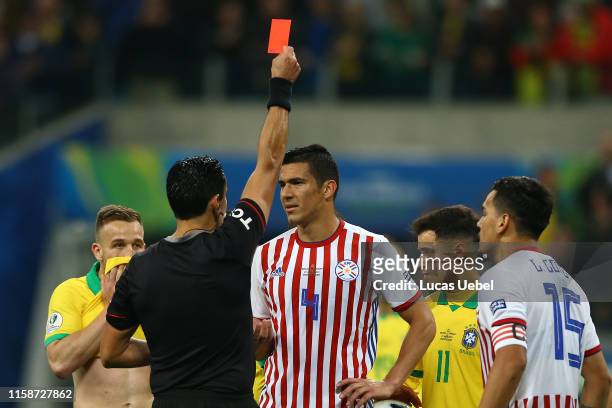 Referee Roberto Tobar Vargas shows a red card to Fabian Balbuena of Paraguay during the Copa America Brazil 2019 quarterfinal match between Brazil...