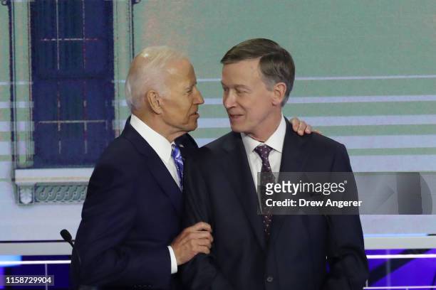 Former Vice President Joe Biden greets Sen. Michael Bennet during the second night of the first Democratic presidential debate on June 27, 2019 in...