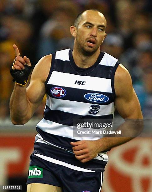 James Podsiadly of the Cats celebrates a goal during the round 12 AFL match between the Geelong Cats and the Hawthorn Hawks at Melbourne Cricket...