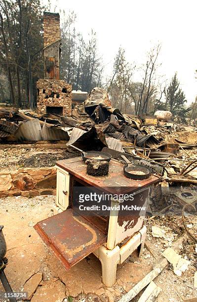 Skillets sit atop an old stove in the ruins of the Road's End Lodge July 24, 2002 in the Sequoia National Forest north of Kernville, California....