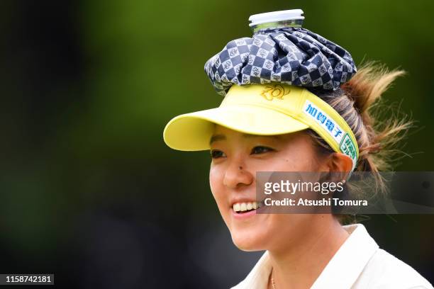 Eimi Koga of the United States puts an ice bag on her head to cool down during the second round of the Earth Mondamin Cup at the Camellia Hills...