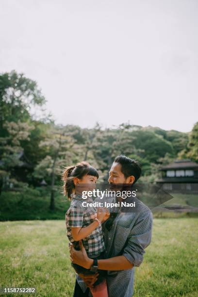 japanese father and preschool mixed race daughter having intimate moment - mixed race family stock-fotos und bilder