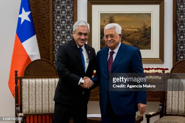 President of Palestine Mohmoud Abbas , shakes hands with President of Chile Sebastián Piñera , during a working meeting at the Presidential Palace of...