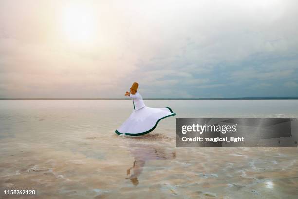 sunset and whirling at the sea, sufi. sufi whirling (turkish: semazen) is a form of sama or physically active meditation which originated among sufis. - sufi whirling stock pictures, royalty-free photos & images