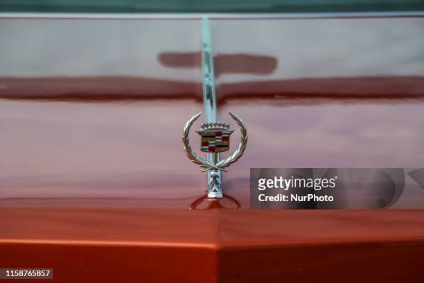 Red Cadillac Eldorado logo on the bonnet is seen during the every Monday retro cars owners meeting on the public beach in Hevringholm, Denmark on 29...