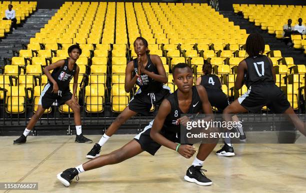 Players warm up on July 29 at the Dakar Arena in Diamniadio, during the opening of the 17th Basketball Without Borders Africa organised by the NBA,...