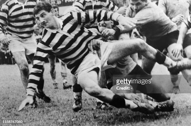 Mont-de-Marsan's team player Benoit Dauga is thrown to the ground by Dijon players during the French Championship of 1st Federal Division Rugby to XV...