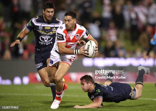 Corey Norman of the Dragons makes a break during the round 15 NRL match between the St George Illawarra Dragons and the North Queensland Cowboys at...