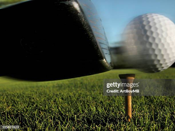 a close up shot of a golf club hitting the ball at the tee - drive ball sports stock pictures, royalty-free photos & images