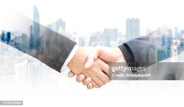 businessmen are shaking hands to agree to a business deal distribution network logistics on the background. transport & logistics concepts for industrial cargo containers for express delivery concepts - employee engagement banner stock pictures, royalty-free photos & images