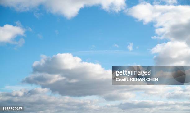 photo of some white whispy clouds and blue sky cloudscape - wispy stock pictures, royalty-free photos & images