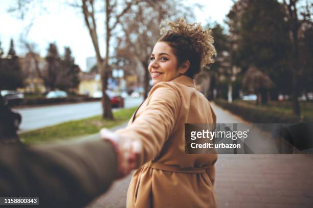 holding hands - walking personal perspective stock pictures, royalty-free photos & images