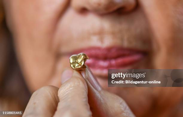 Small Gold Tooth Gold Teeth Images Photos and Premium High Res Pictures - Getty Images