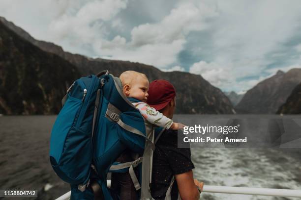 father with baby on lake cruise, queenstown, canterbury, new zealand - family new zealand stockfoto's en -beelden