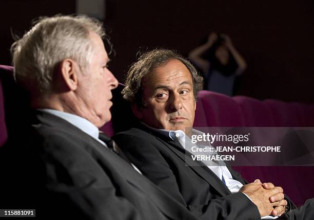 President Michel Platini, looks at his father Aldo , as he gives an interview to French television after attending a general assembly of the Lorraine...