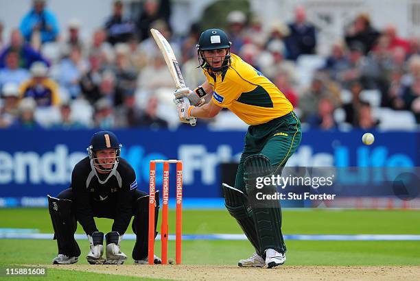 Nottinghamshire batsman Alex Hales hits out watched by wicketkeeper Tim Ambrose during the Friends Life T20 match between Nottinghamshire and...