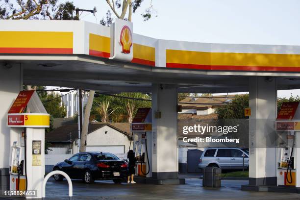 Customer refuels a vehicle at a Royal Dutch Shell Plc gas station in Torrance, California, U.S., on Sunday, July 28, 2019. Royal Dutch Shell is...