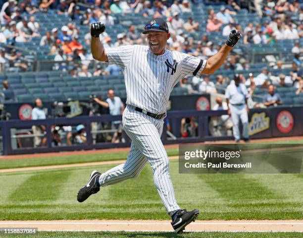 Former Yankees pitcher Mariano Rivera, who will be inducted into the Baseball Hall of Fame this year, celebrates hitting a home run as he runs up the...