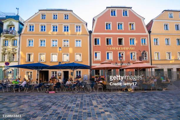 street cafe in regensburg, germany. - regensburg stock pictures, royalty-free photos & images