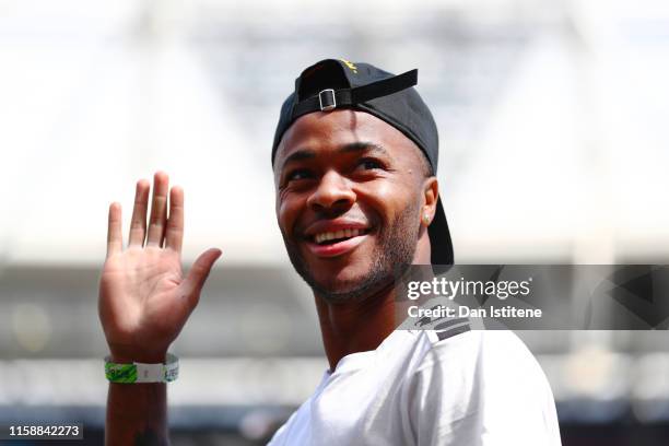 Raheem Sterling of England and Manchester City waves to the fans from the field during previews ahead of the MLB London Series games between Boston...