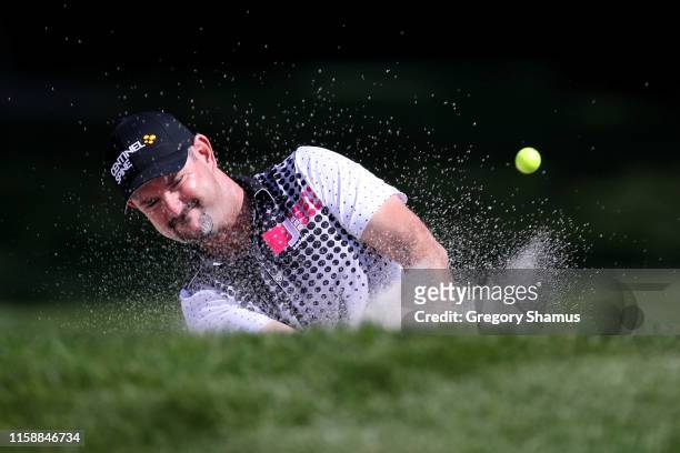 Rory Sabbatini of Slovakia plays his shot from a bunker on the 11th hole during round two of the Rocket Mortgage Classic at the Detroit Country Club...