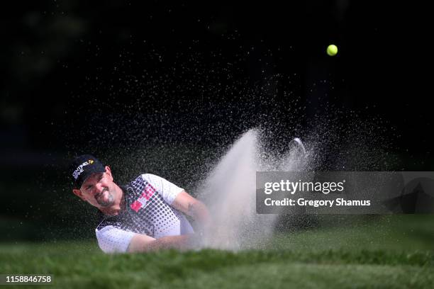 Rory Sabbatini of Slovakia plays his shot from a bunker on the 11th hole during round two of the Rocket Mortgage Classic at the Detroit Country Club...