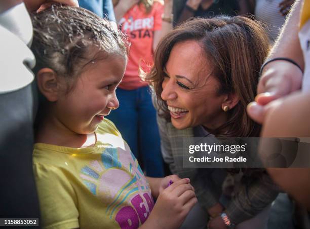 Democratic presidential candidate, Sen. Kamala Harris speaks with Roxanna Gozzer, whose mother is originally from El Salvador and is in the U.S....