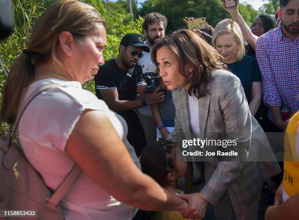Democratic Presidential candidate, Sen. Kamala Harris speaks with Lili Montalban and her daughter Roxanna Gozzer, as she visits the outside of a...