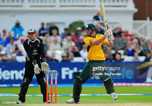 Nottinghamshire batsman Alex Hales hits out watched by wicketkeeper Tim Ambrose during the Friends Life T20 match between Nottinghamshire and...