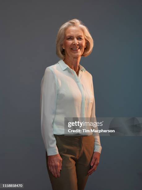portrait of senior business woman smiling - 65 69 years stock pictures, royalty-free photos & images