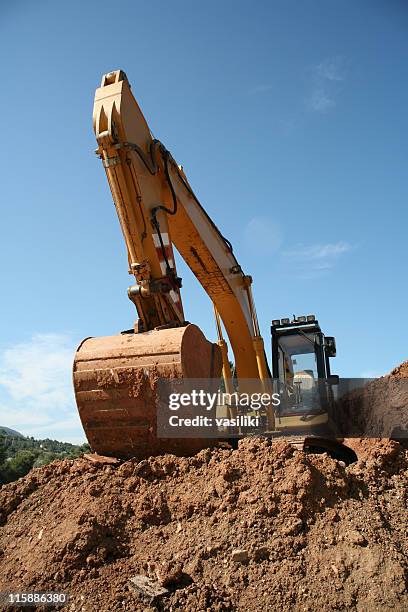 excavator earthworks-amarillo - movimiento de tierras fotografías e imágenes de stock