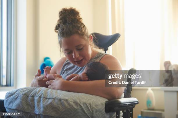 Disabled mother with newborn baby.