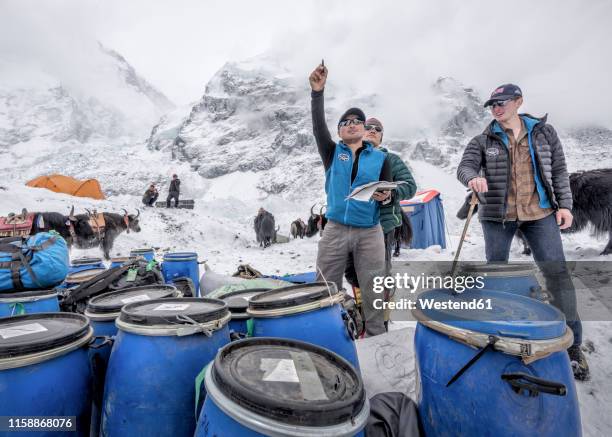 nepal, solo khumbu, everest base camp, sherpas checking provisions - base camp stock pictures, royalty-free photos & images