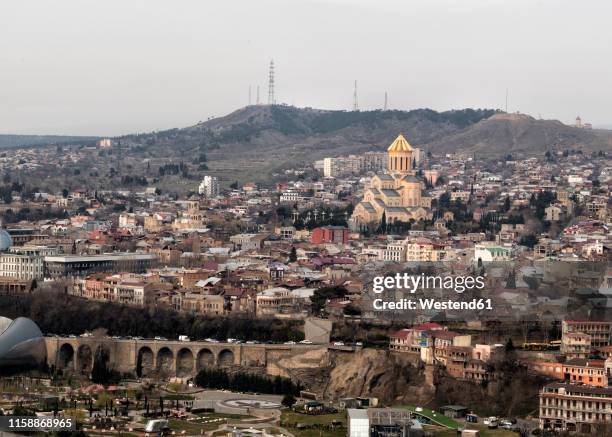 georgia, tbilisi, cityscape with holy trinity cathedral - capital cities stock pictures, royalty-free photos & images