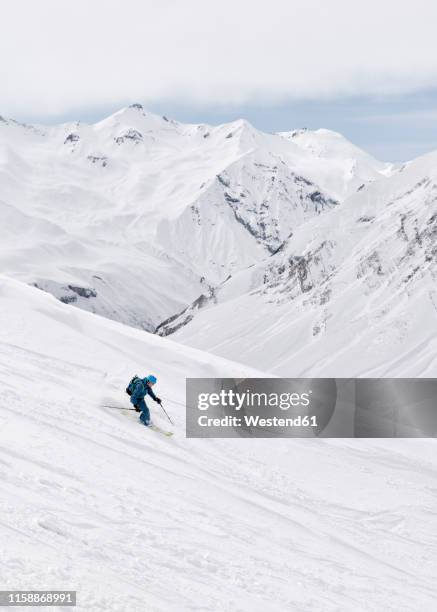 georgia, caucasus, gudauri, man on a ski tour riding downhill - downhill bildbanksfoton och bilder