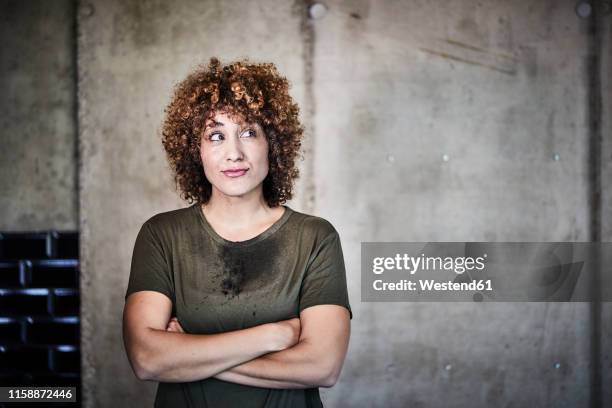 portrait of smiling woman with stained t-shirt - curly hair woman white shirt stock pictures, royalty-free photos & images